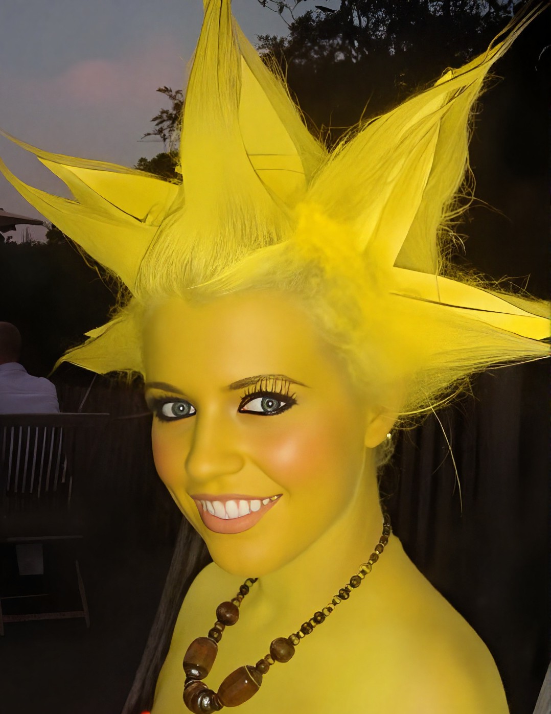Full yellow body paint Lisa Simpson character makeup with sculpted spiked hair